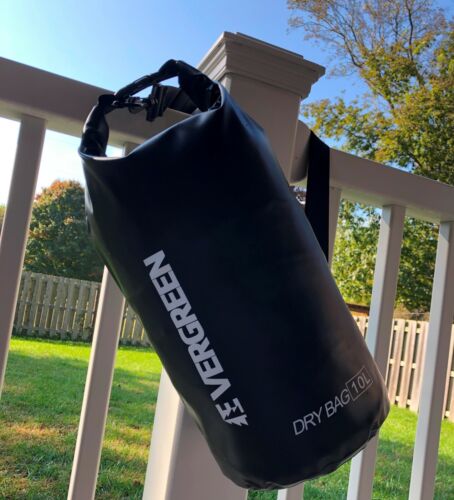 Person kayaking with a yellow waterproof dry bag secured on the deck, ideal for water sports gear