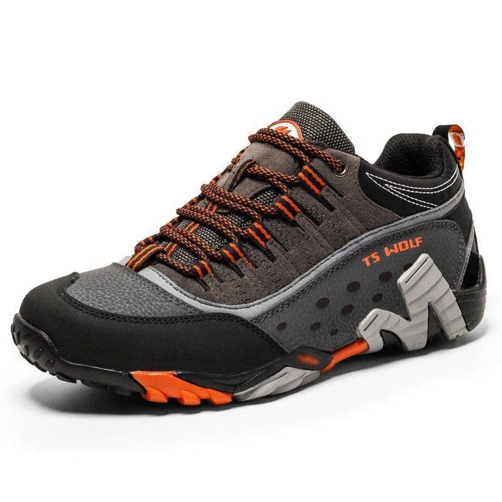 Waterproof leather trekking boots, unisex design, shown with mud splashes after a hike