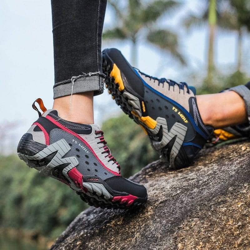 Side view of tan waterproof leather hiking boots, ideal for trekking and mountain trails