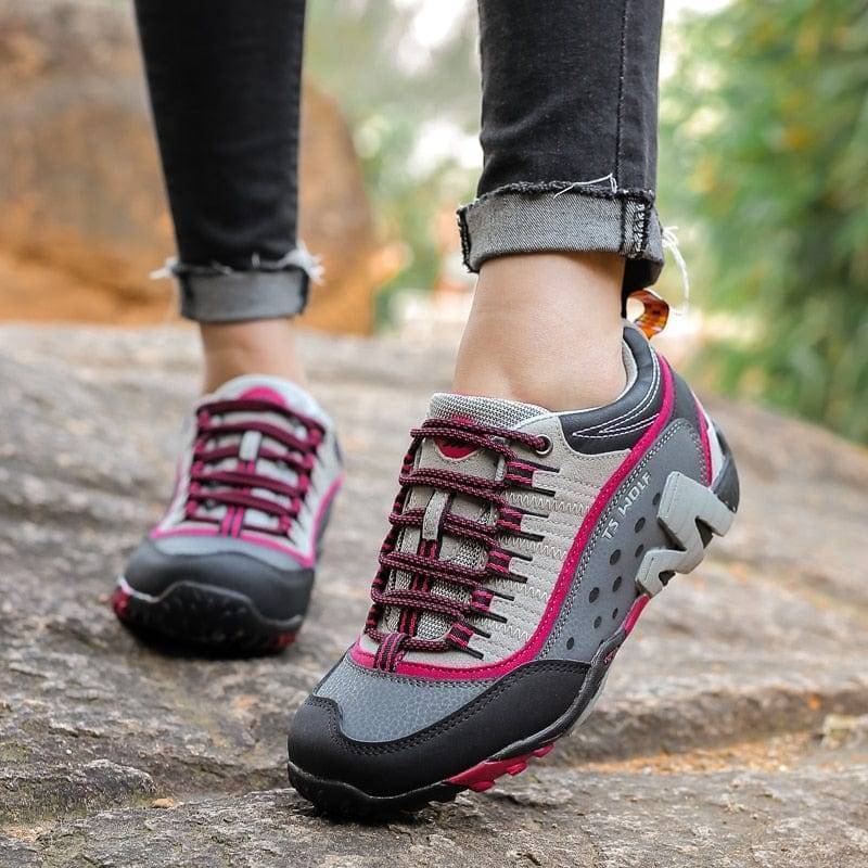 Detail of waterproof leather upper on hiking boots, showing stitching and texture