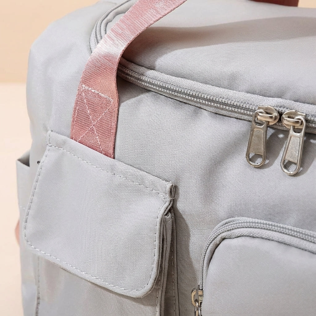 Stylish unisex waterproof nylon duffel bag for gym, sports, and weekend getaways. Durable & versatile design.