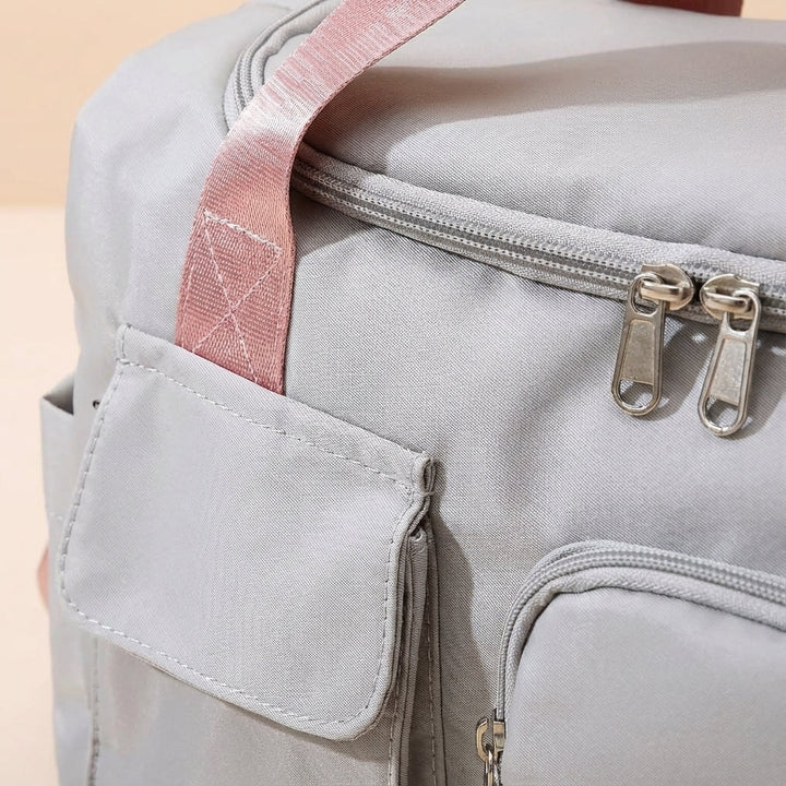Stylish unisex waterproof nylon duffel bag for gym, sports, and weekend getaways. Durable & versatile design.