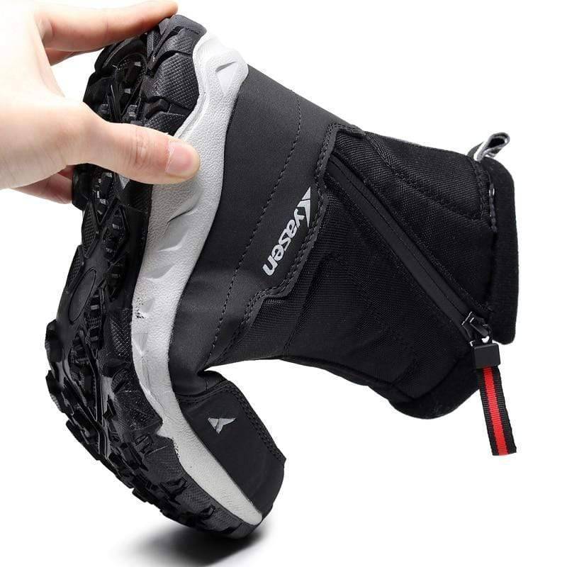 Unisex sneaker-style winter boots with plush lining, ideal for snow and outdoor activities.