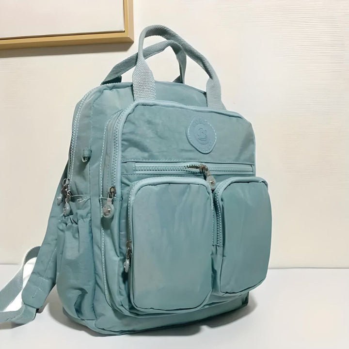 Fashionable unisex urban backpack. Waterproof design with practical multi-pockets for city life.