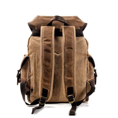Durable waxed canvas backpack with waterproof finish, perfect for camping & outdoor travel gear