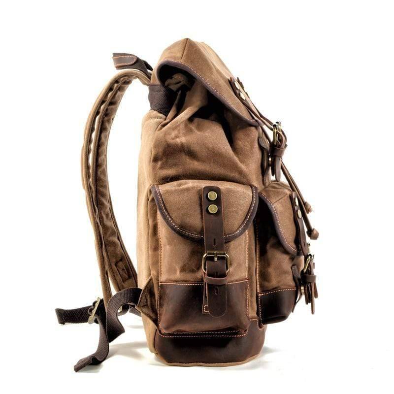 Close-up of the waterproof waxed canvas backpack material, highlighting its rugged texture & quality