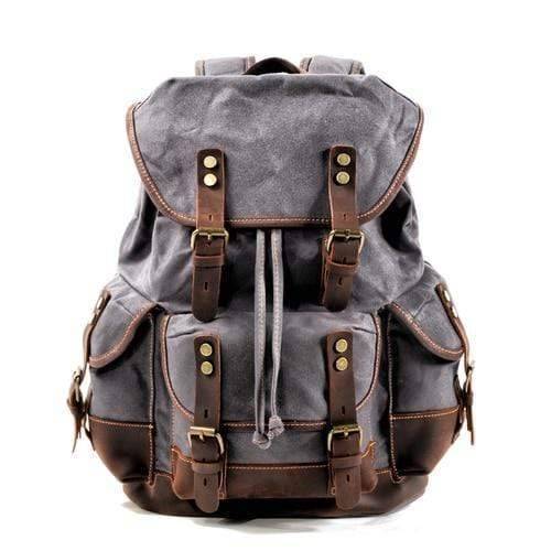 Detail of the durable hardware & leather accents on the waxed canvas outdoor equipment backpack
