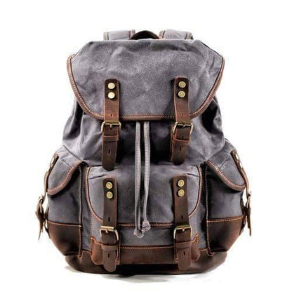 Detail of the durable hardware & leather accents on the waxed canvas outdoor equipment backpack
