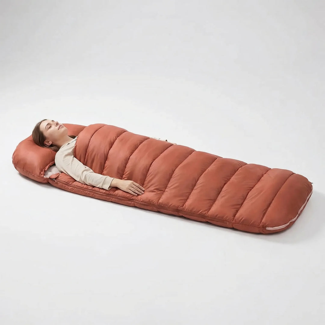 Adult enjoying comfort in a wide 3-season sleeping bag inside a tent, perfect for camping & hiking.