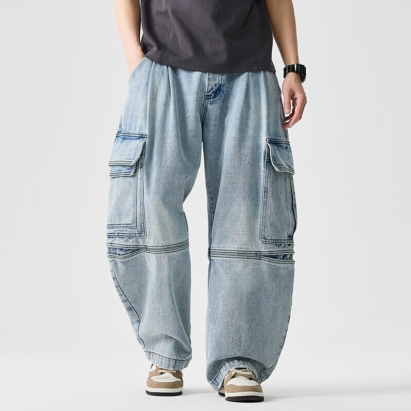 Close-up of unisex wide-leg denim pants, highlighting durable fabric and adjustable waist details.