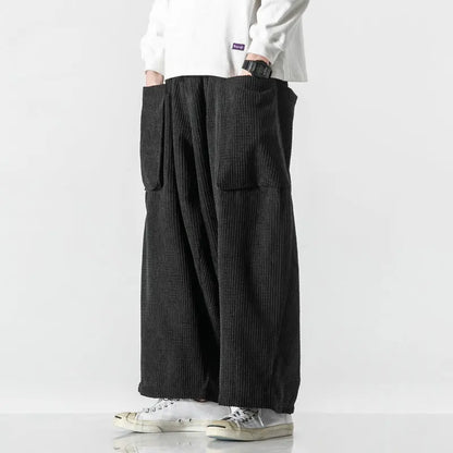 Dark blue unisex wide leg sweatpants; relaxed fit for ultimate comfort. Adjustable waist, great for lounging.
