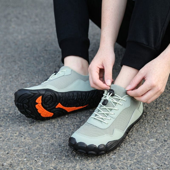 Wide toe box orthopedic trail shoes, promoting natural foot splay for comfortable hiking.