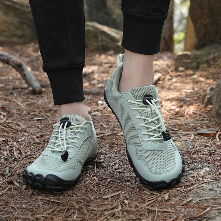 Flexible, breathable unisex hiking shoes with wide toe box, orthopedic for natural outdoor wear.
