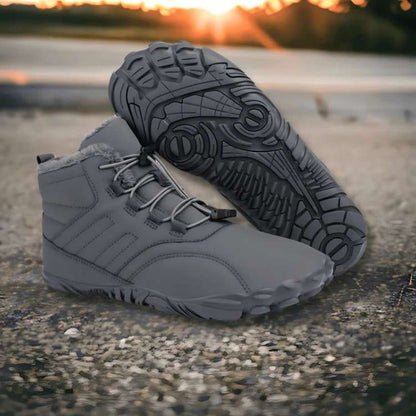Unisex winter barefoot shoes, waterproof and non-slip, in black, showing flexible sole and wide toe box