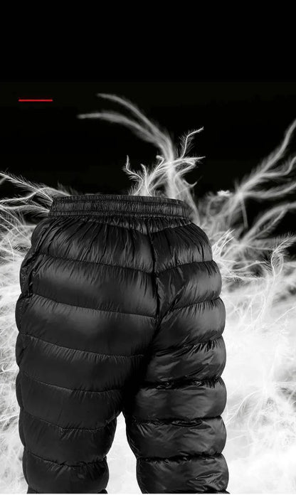 Pair of black down-filled hiking pants, folded, highlighting insulation and warmth