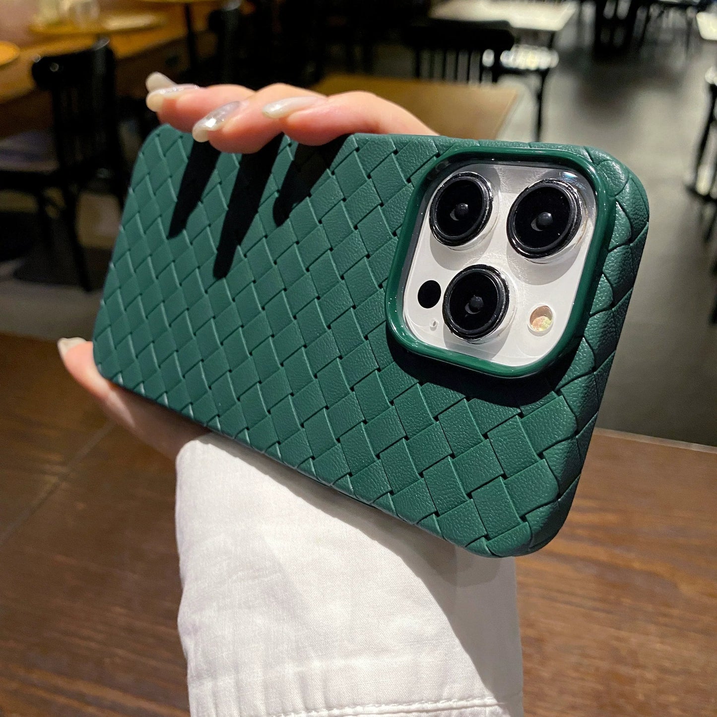 Protective iPhone case with a unique woven texture. Slim, shockproof, and wireless charging compatible TPU accessory.