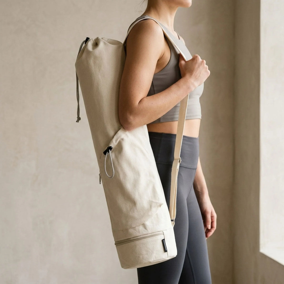 Unisex yoga mat carrier bag with adjustable strap & pockets. Perfect for gym, pilates, or fitness.