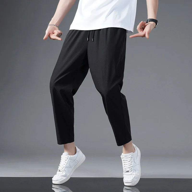 Model wearing unisex Zephy comfort pants, showcasing lightweight, moisture-wicking fabric for active lifestyles.