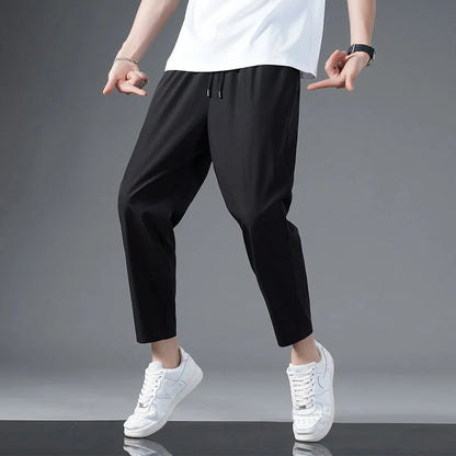 Model wearing unisex Zephy comfort pants, showcasing lightweight, moisture-wicking fabric for active lifestyles.