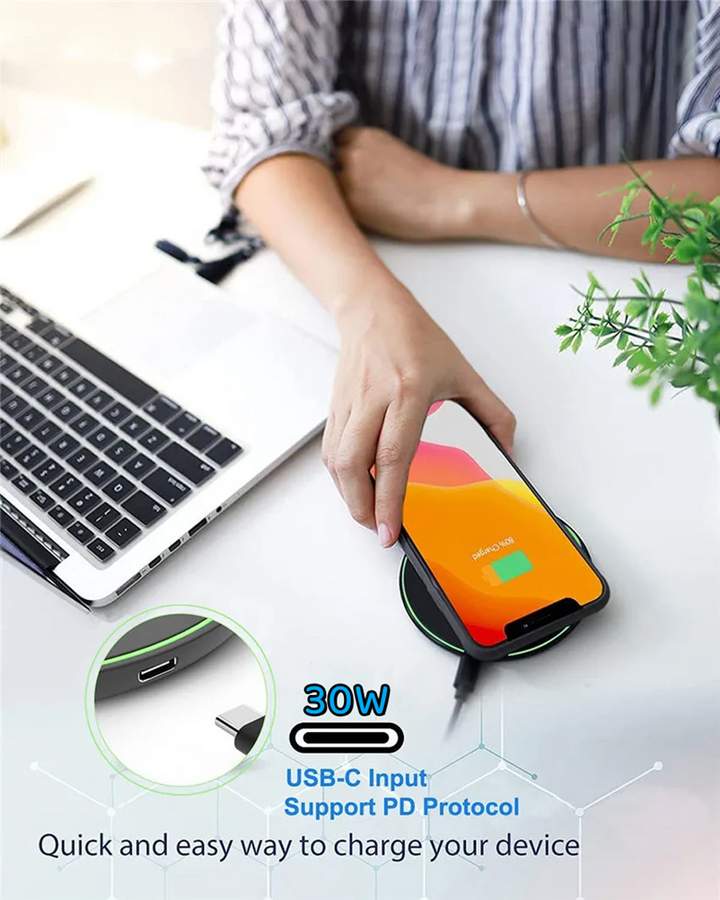 Portable 30W universal wireless fast charger pad for smartphones, a convenient tech gadget.