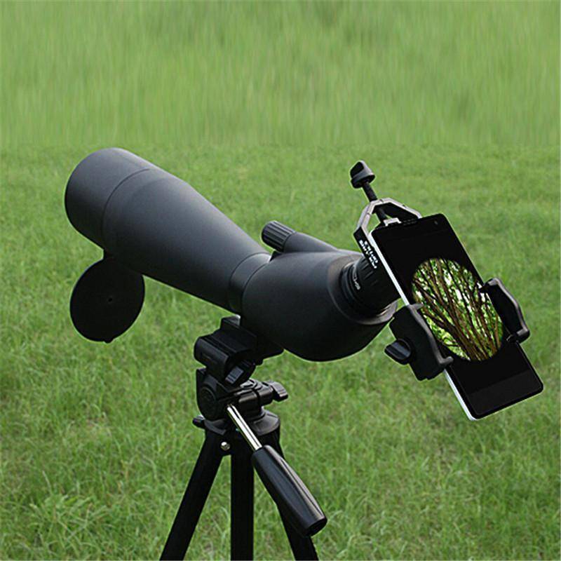 Smartphone attached to monocular with universal adapter for birdwatching photography