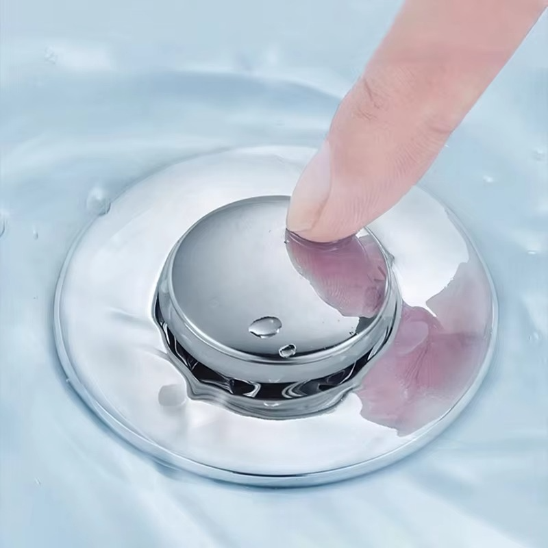 Secure your drains with a universal fit pop-up sink stopper and hair catcher, perfect for any kitchen or bathroom.