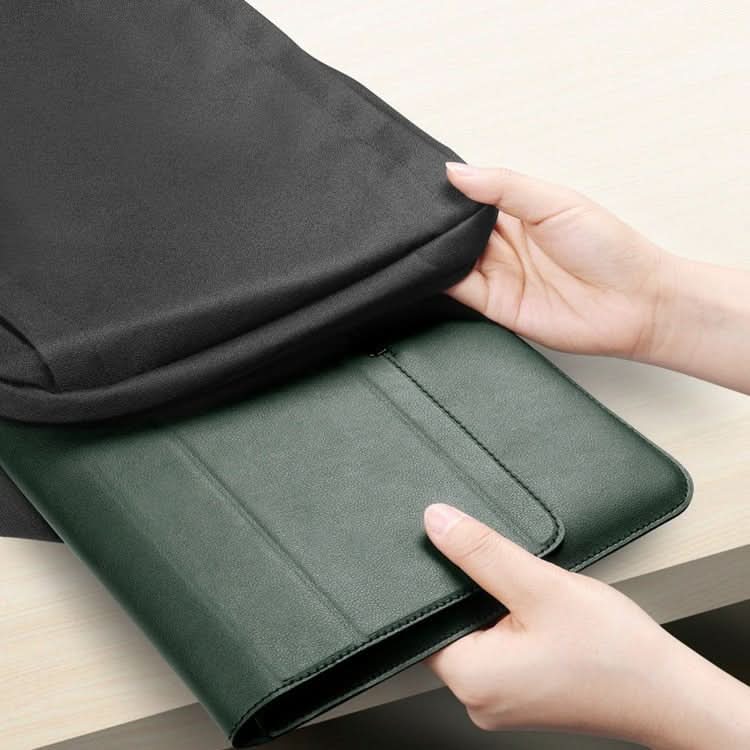 Waterproof laptop sleeve FlexiGuard protecting a laptop from spills on a desk.
