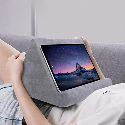 Universal tablet pillow stand for hands-free viewing, soft suede, ergonomic design.