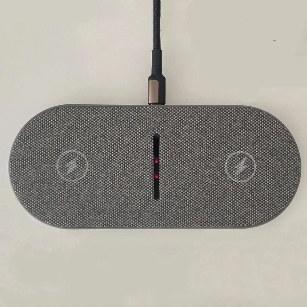 Dual wireless fast charger pad for phones and earbuds. Qi compatible, providing quick power for your devices.