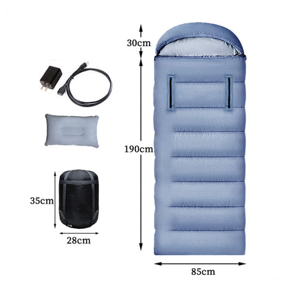 Adventure seeker standing next to a campfire with a USB heated sleeping bag at a winter campsite.