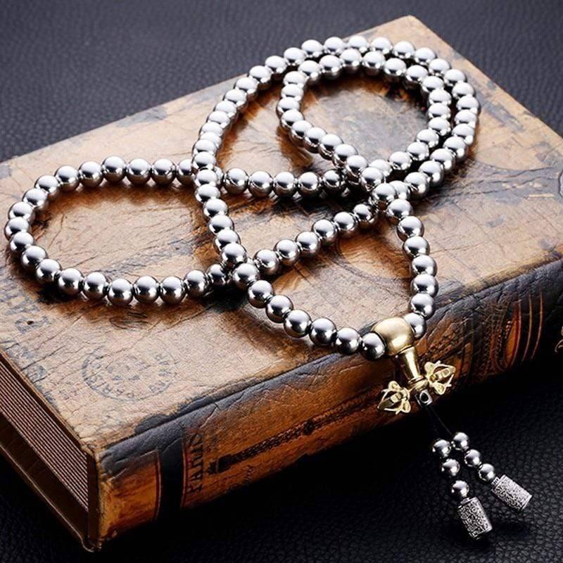 Outdoor gear: 10mm Buddha Beads EDC Chain next to a compass and multi-tool, perfect for survival.