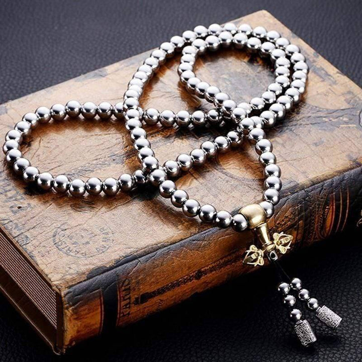 Outdoor gear: 10mm Buddha Beads EDC Chain next to a compass and multi-tool, perfect for survival.