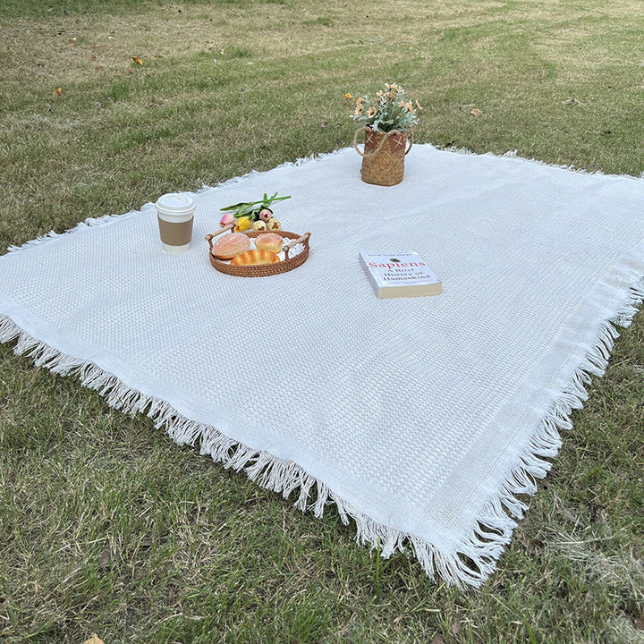 Moisture resistant outdoor blanket, checkered pattern, durable for camping trips