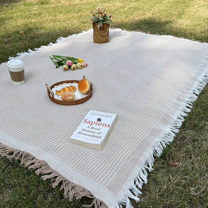 Versatile checkered blanket, perfect for camping, picnics, and as a stylish home throw