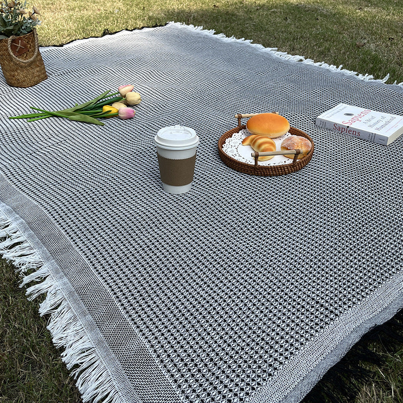 Easy care plaid blanket, versatile for camping, travel, and as a cozy home accessory