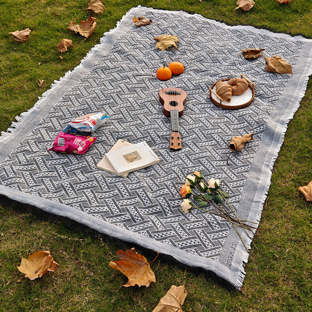 Boho chic checkered throw blanket, versatile for camping, picnics, and stylish homes