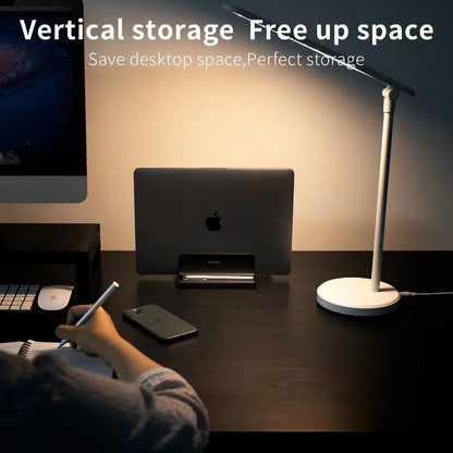 Adjustable universal vertical laptop stand for desks. Organizes tech accessories, saves home office space.
