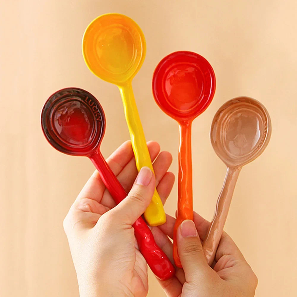 Single colorful ceramic serving spoon with a unique design, part of an 8-piece kitchen set.