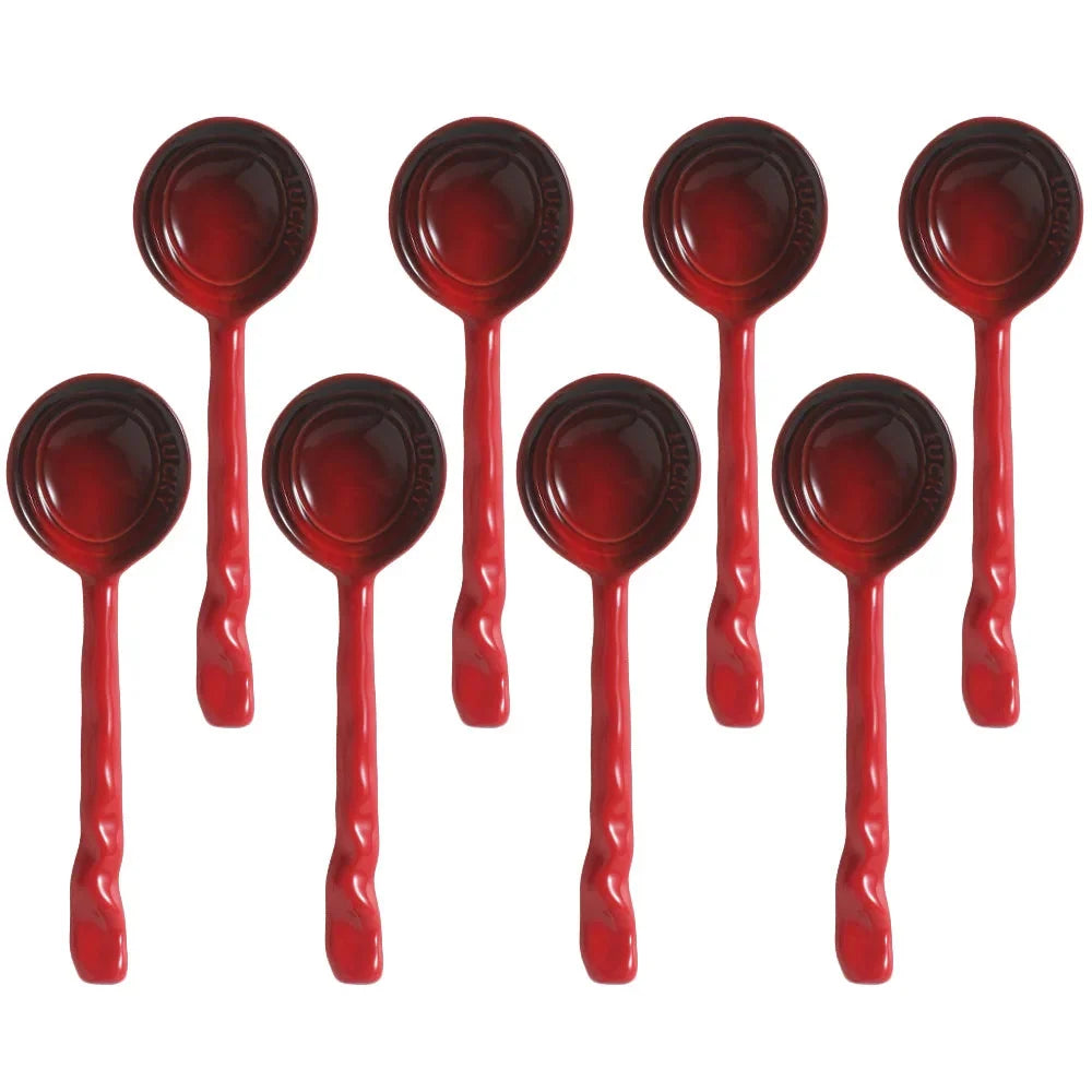 Kitchen scene with vibrant ceramic serving spoons, stylish and functional tableware.