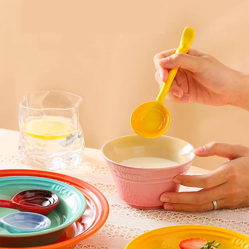 Elegant ceramic serving spoon set, 8 vibrant pieces, perfect kitchen utensils for any meal.