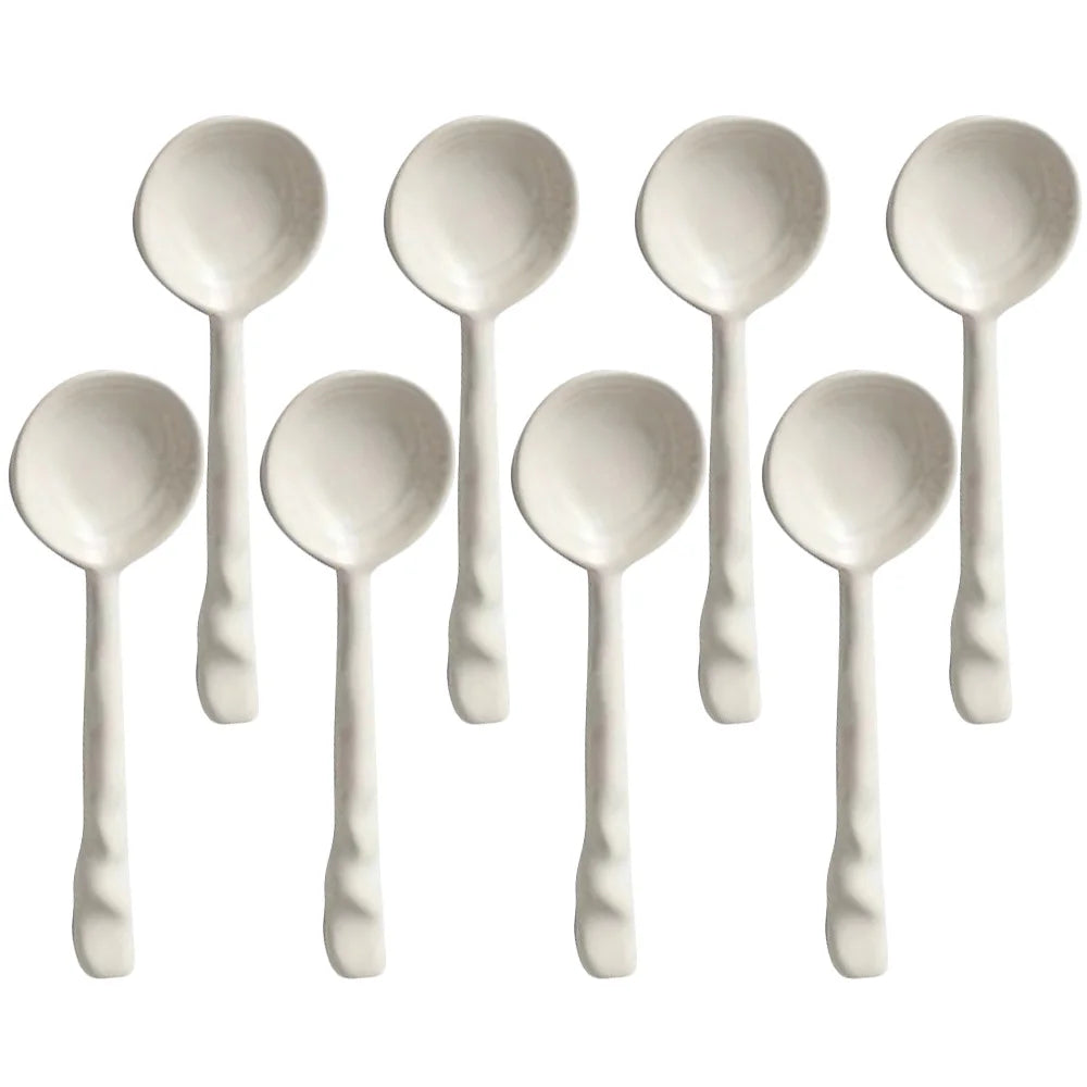 Close-up of a vibrant ceramic serving spoon, a stylish kitchen utensil from the set.