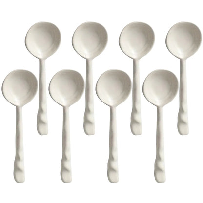 Close-up of a vibrant ceramic serving spoon, a stylish kitchen utensil from the set.