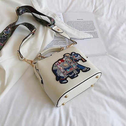 Frontal view of the vibrant embroidered mandala pattern on a women's shoulder bag.
