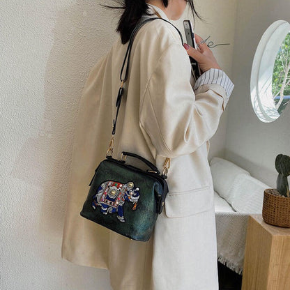Lightweight bohemian crossbody bag with intricate mandala embroidery design.