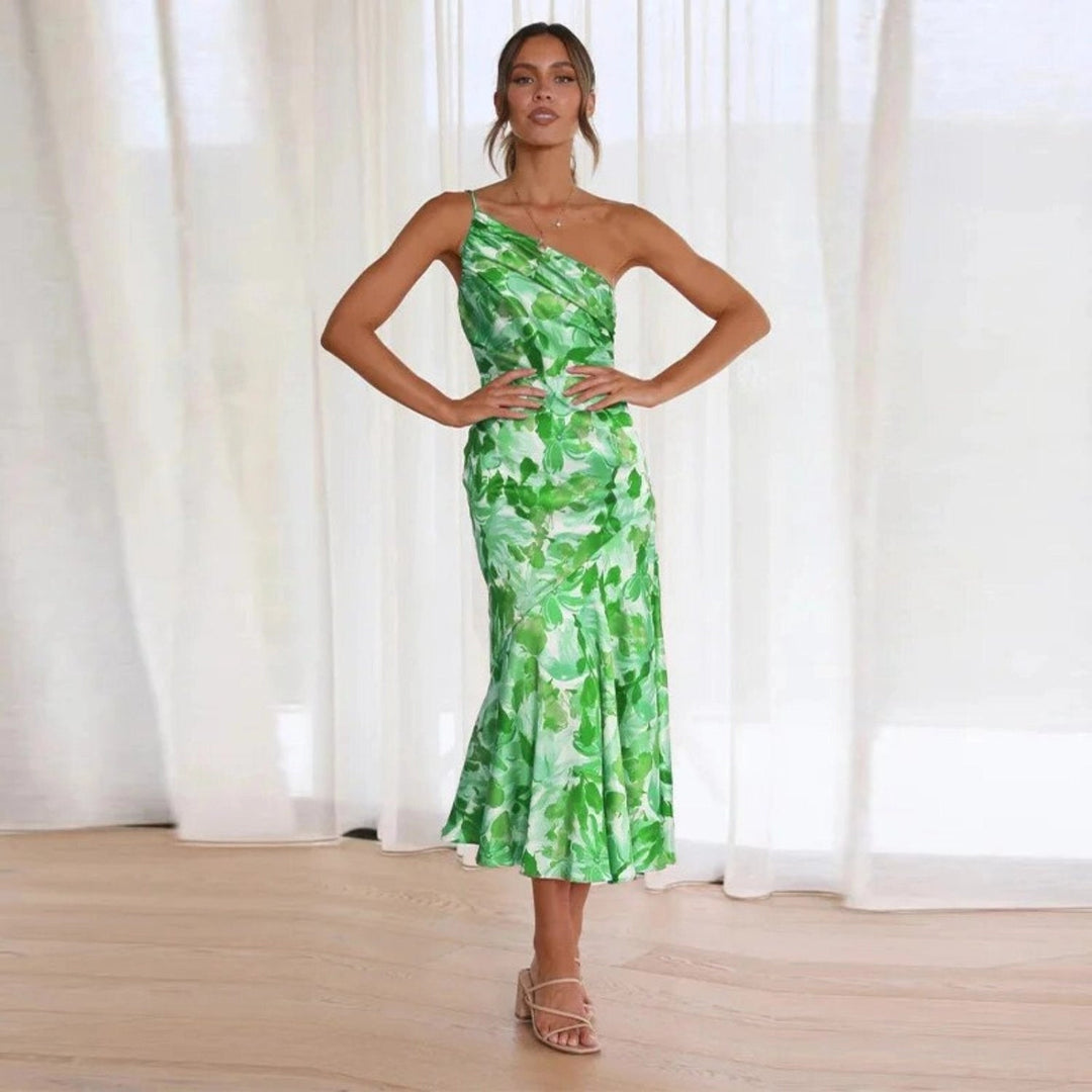 Women's vibrant floral print midi dress, sleeveless, featuring an elegant asymmetric flowing hemline.