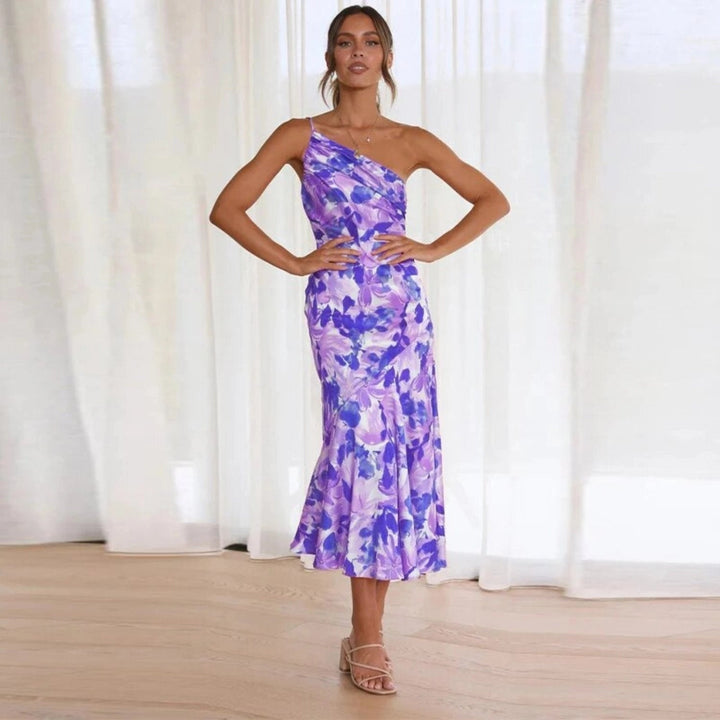 Flowing sleeveless women's floral midi dress, asymmetric hem, comfortable and chic for summer style.
