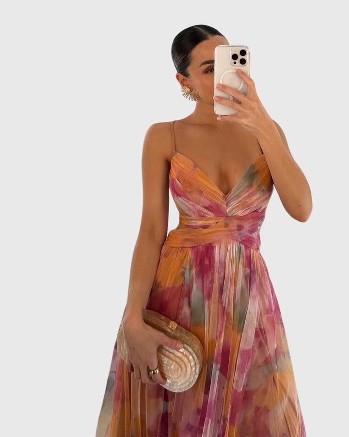 Women's high-waist floral maxi dress with adjustable straps, ideal for vibrant summer casual or party wear.