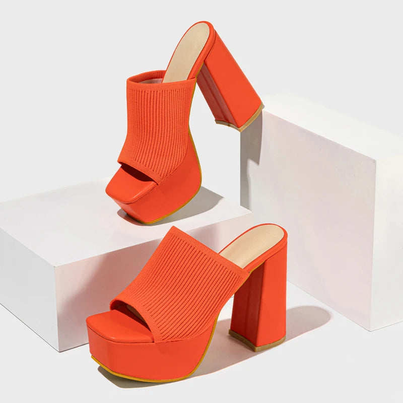 Close-up of textured neon knit platform heels, women's Y2K chunky block heel mules for bold style.