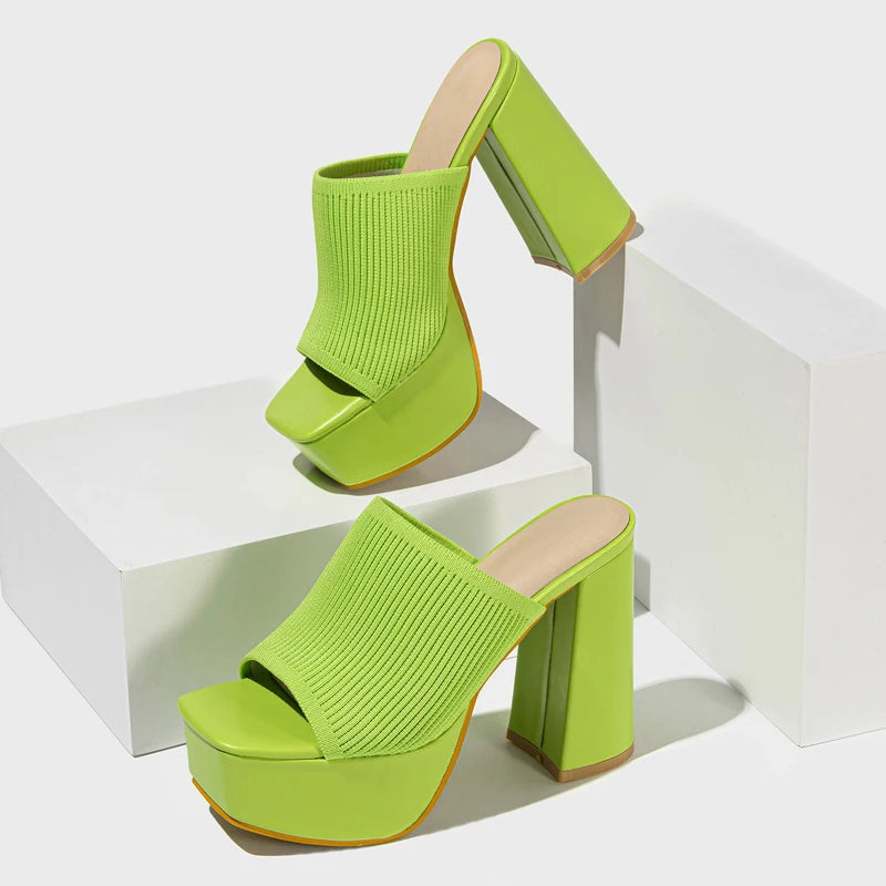 Women's vibrant neon knit platform heels worn, showing chunky block heel, slip-on & Y2K fashion.