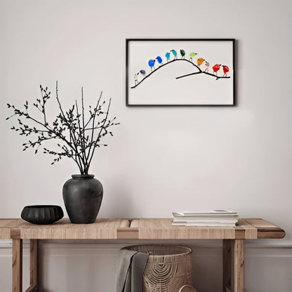 Handmade sea glass bird art with a rainbow of colors, perfect sustainable coastal wall decor.